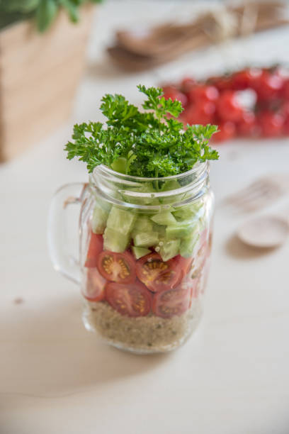 istock Quinoa salad in a glass with vegetables 686478116