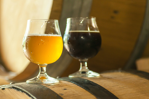 Dark And Light Beer On A Barrel Stock Photo Download Image Now dark-and-light-beer-on-a-barrel-stock-photo-download-image-now
