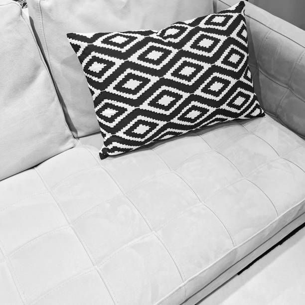 istock Black and white ornamental cushion on a sofa 686508194
