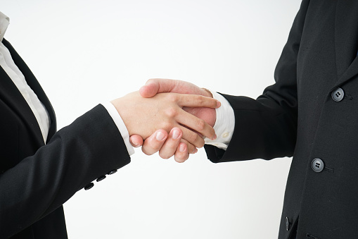 Business persons shaking hands