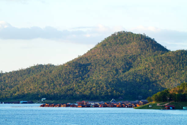 Resort seen from Sinakharin Dam and viewpoint. Area of Sinakharin lake in Kanchanburi. View over lake towards resort buildings on lake. At this lakeside are two resorts: this one is Ananta River Hills Resort.