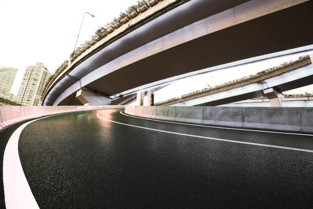istock Empty road floor with city overpass viaduct bridge 686512538