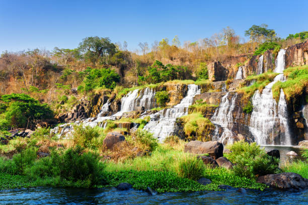 istock Scenic view of natural cascading waterfall in autumn 686516004