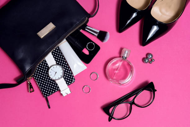 istock Top view female fashion accessories on pink flat lay 686519082