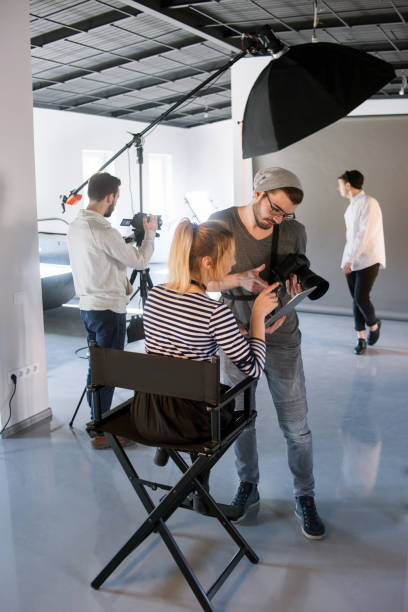 istock Photographer discussing with art coordinator 686522260