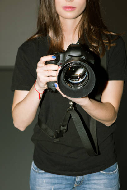 istock Female photographer and camera with big lens 686522568