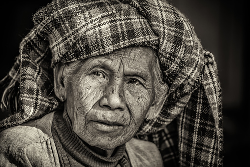 Pindaya: Black and white portrait of an old indigenous woman in Myanmar
