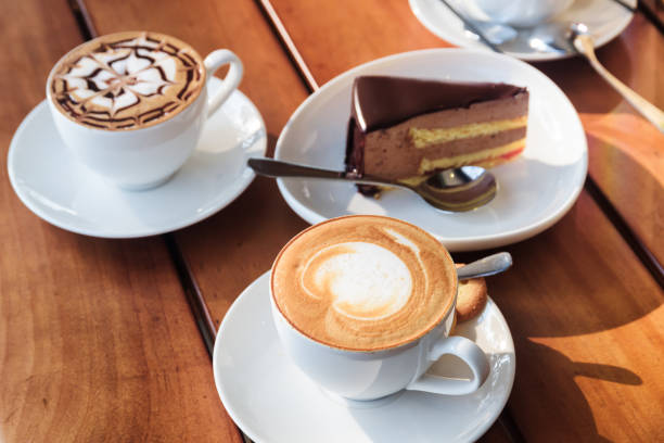 istock Two cups of hot Cappuccino coffee and chocolate mousse cake 686526244