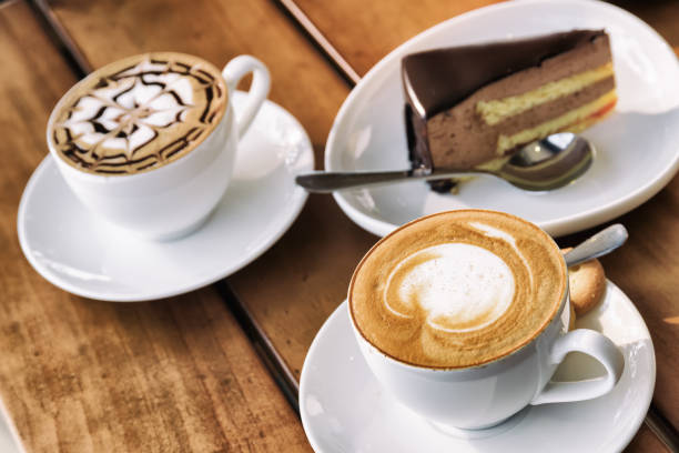 istock Two cups of Cappuccino coffee and chocolate mousse cake 686526418