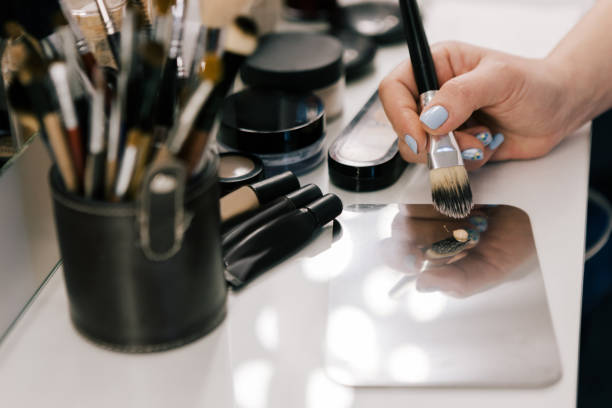 istock Hand of person with makeup brush 686528748