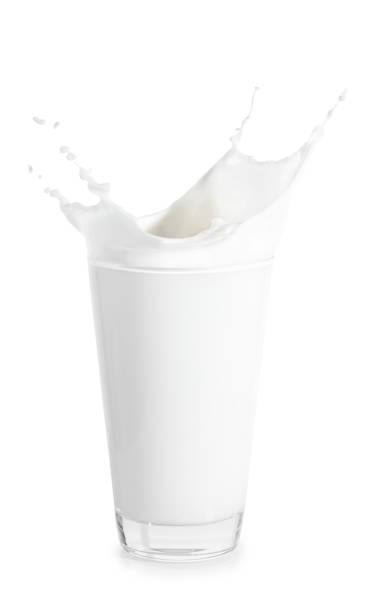 istock glass of milk with splashes 686529414