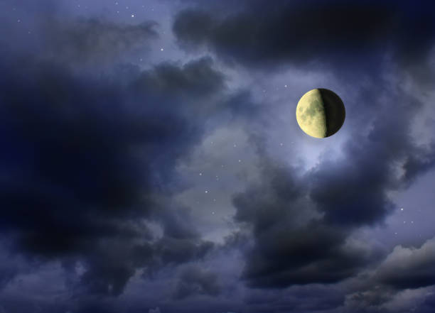 istock Moon glowing in the dark cloudy night sky 686532186