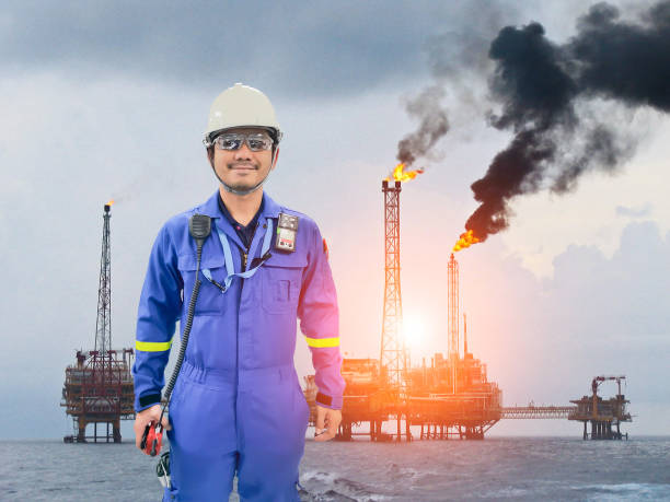 istock Working engineer at offshore oil and gas refinery 686540392