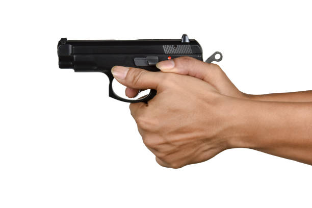 istock a hand with handgun thumb forward position gripping 686549824