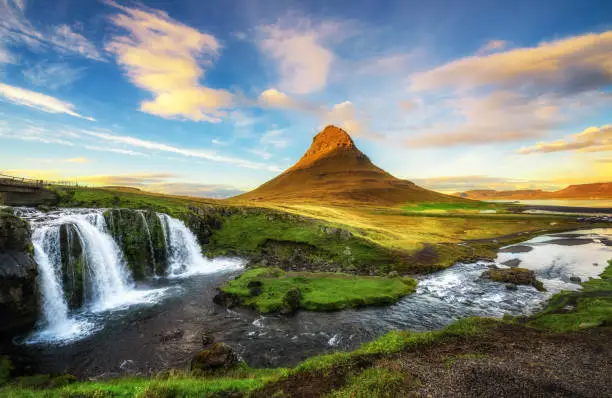 Photo of Sunset over Kirkjufellsfoss Waterfall and Kirkjufell mountain in Iceland