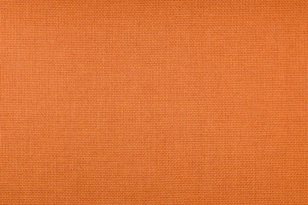 istock orange fabric detail texture 686552572