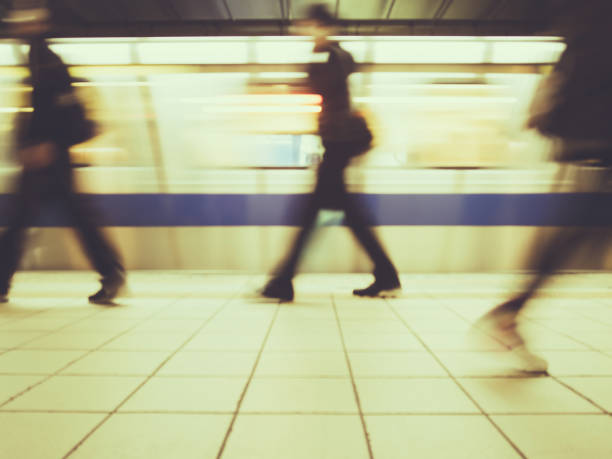 istock Subway train leaving station. People coming to or leaving the platform. 686553684