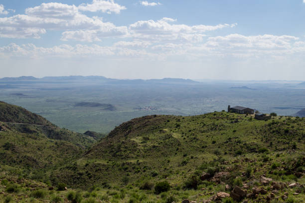 istock Lush Mountain Landscape with Road and House with a View in Namibia 686562124