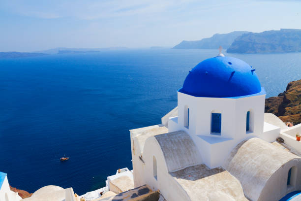 istock traditional blue dome with sea, Santorini 686562322