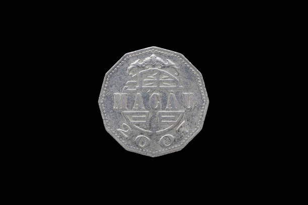 istock Macao 5 pataca coin year 2007 isolated on black background. 686574990