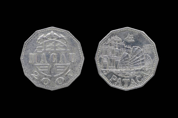 istock Macao 5 pataca coin year 2007 isolated on black background. 686575040