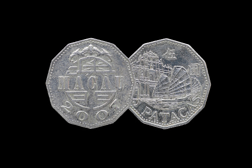 Macao 5 pataca coin year 2007 isolated on black background.