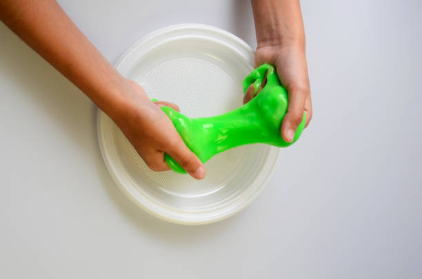 istock Pate slime elastic and viscous on child's hand 686575258