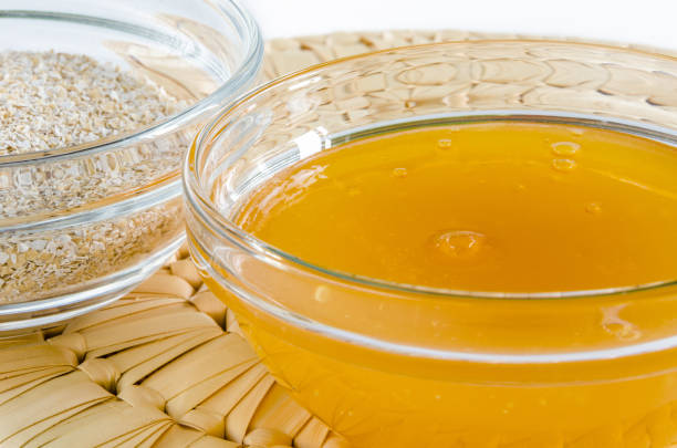 istock Oat bran and honey in a glass bowl 686578378