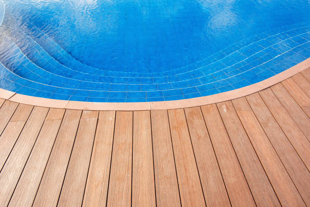 istock Wooden platform beside swimming pool 686587962