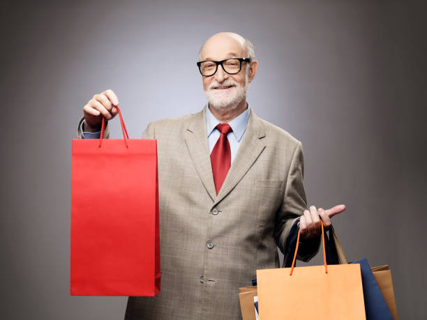 istock Senior man with shopping bags 686588232