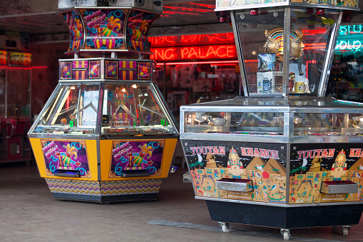 Saint Denis, Reunion - August 13 2016: Penny Falls Arcade Machines and other arcade games in a carnival.