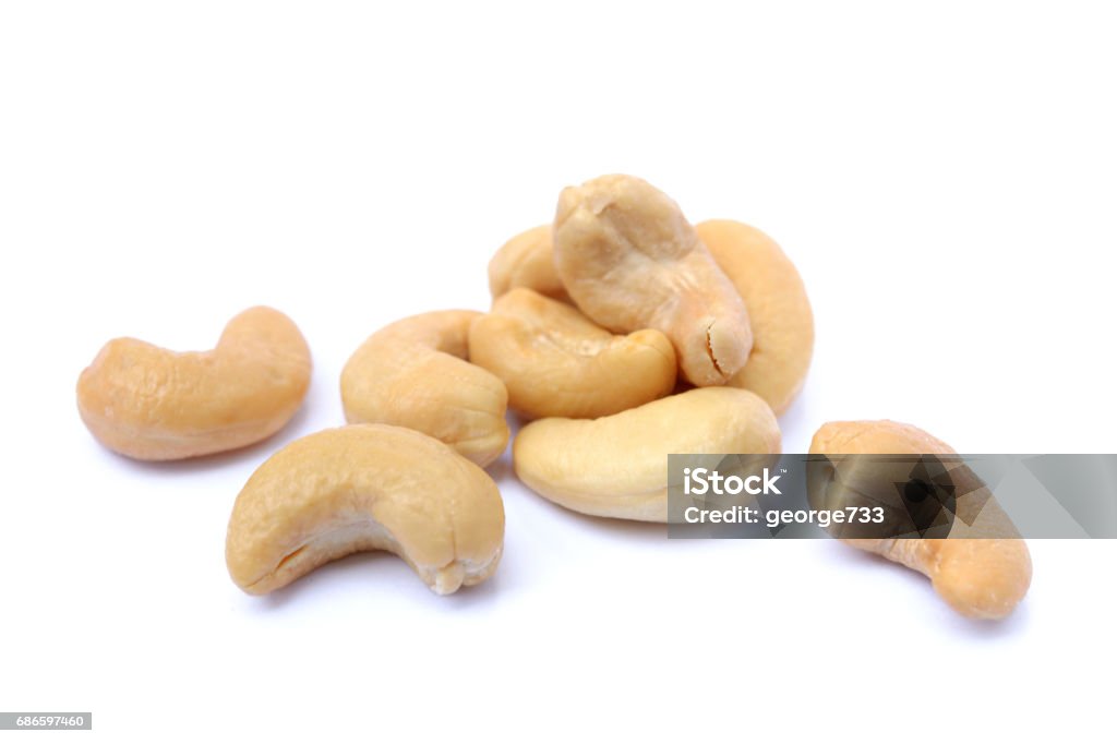 Roasted salted cashews Roasted salted cashews isolated on a white background Cashew Stock Photo
