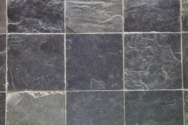 istock Texture of black stones wall background. 686611214