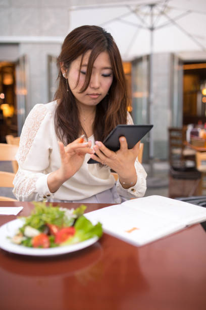 istock Business woman working with digital tablet during lunch 686623482