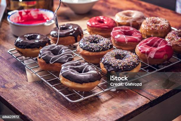 Preparing Homemade Donuts Stock Photo - Download Image Now - Doughnut, Chocolate, Icing