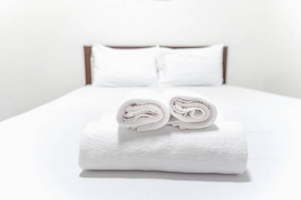 istock White Towel on the bed in hotel. 686635934