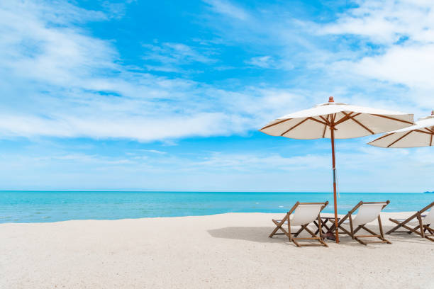 istock Beach chair with umbrella with blue sky on tropical beach. 686636902