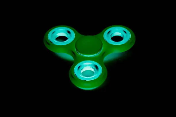 Photo of Fidget Spinner in black isolated background