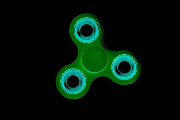 Photo of Fidget Spinner in black isolated background