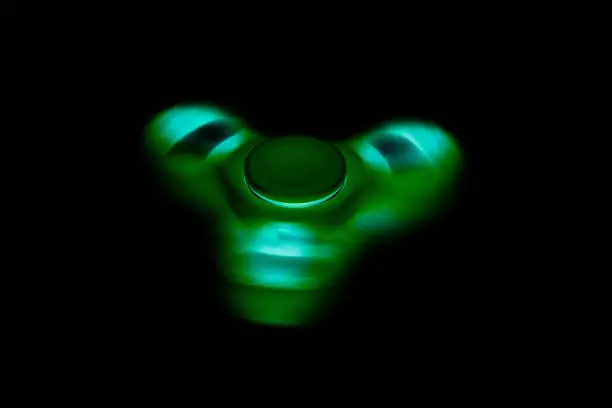 Photo of Fidget Spinner in black isolated background