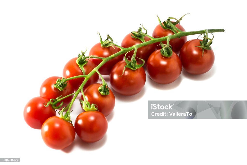 Mature cherry tomatoes o a white background. Mature cherry tomatoes on a white background. Isolated Biology Stock Photo