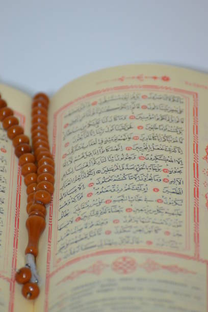 istock prayer beads with The Holy Quran 686649542