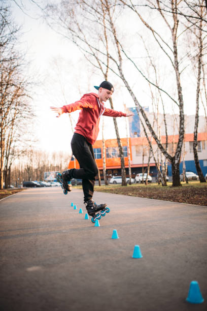 istock Roller skater legs in skates on asphalt walkway 686654628