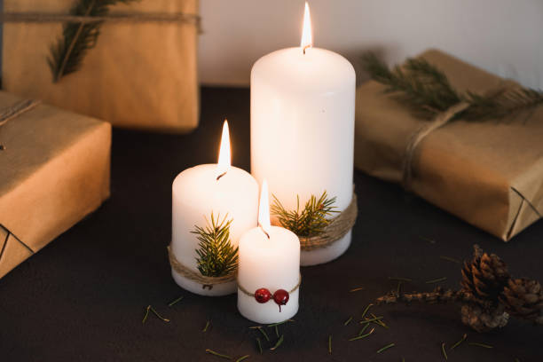 istock Christmas decorations on tha table, lit candles and gifts 686656952