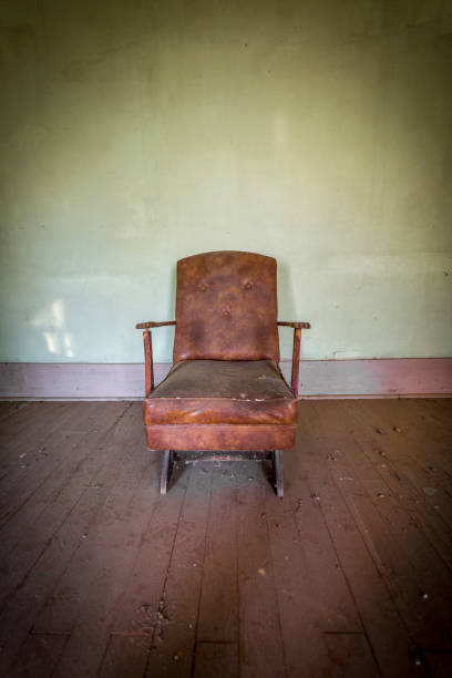 istock Old chair sitting in an abandoned home 686669982