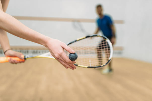 istock Couple play squash game in indoor training club 686674730
