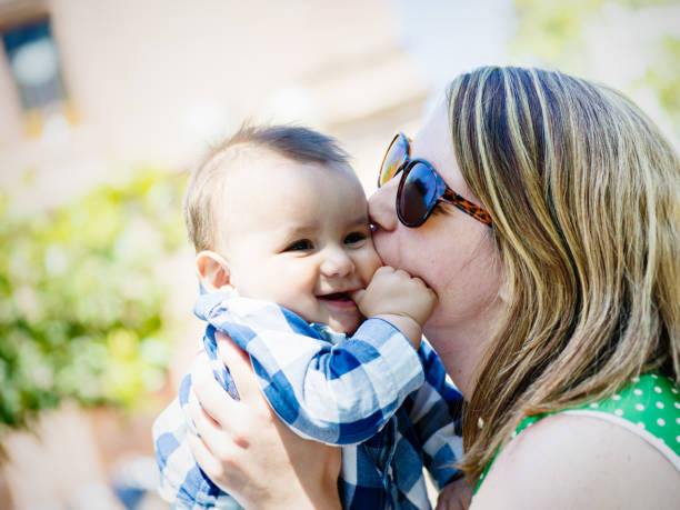 istock Real mother with little son in park 686674864