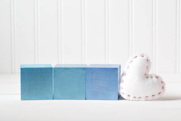 blue wooden blocks with heart cushion - cushion pillow heart shape multi colored imagens e fotografias de stock