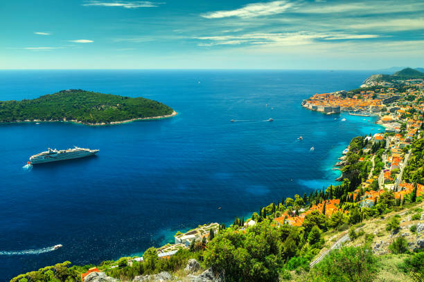 Amazing panoramic view of the walled city Dubrovnik, Dalmatia, Croatia Majestic panorama of Dubrovnik with old town and famous clean beaches, Dalmatia, Croatia, Europe adriatic sea stock pictures, royalty-free photos & images