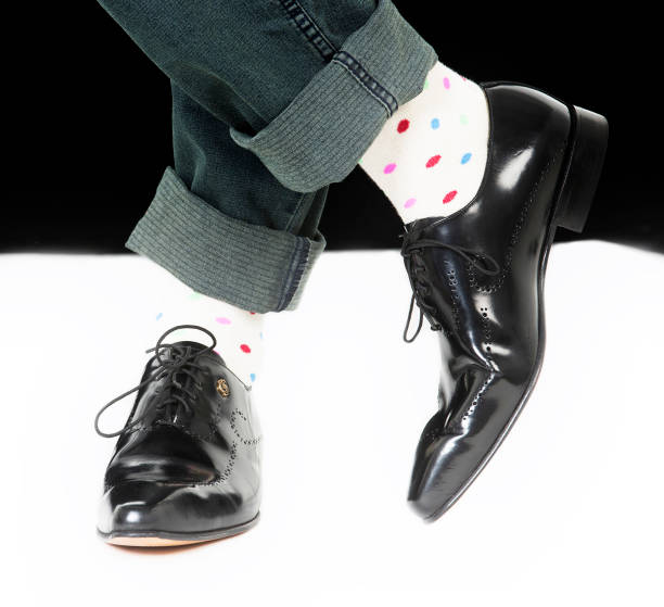 istock Mens smart black shoes with spotted retro socks 686696744
